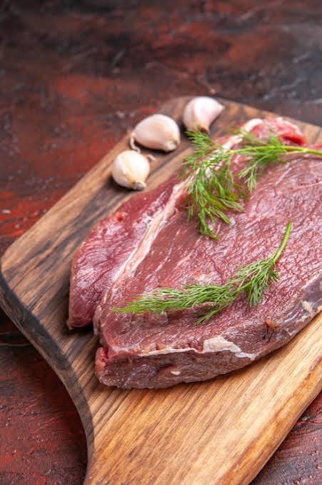 Boneless meat cut on a wooden board